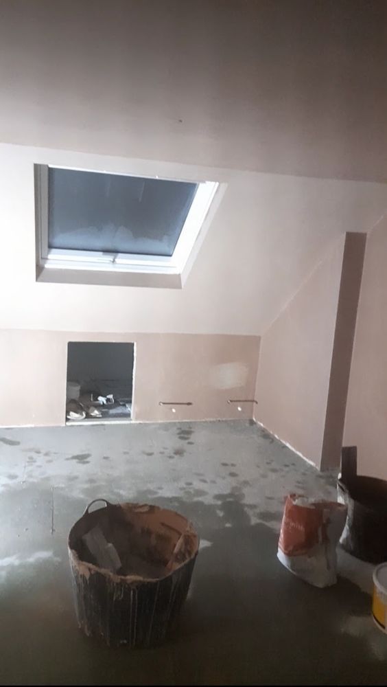 Freshly plastered loft room during an interior refurbishment